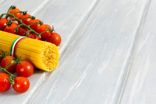 Roll of spaghetti with cherry tomatoes