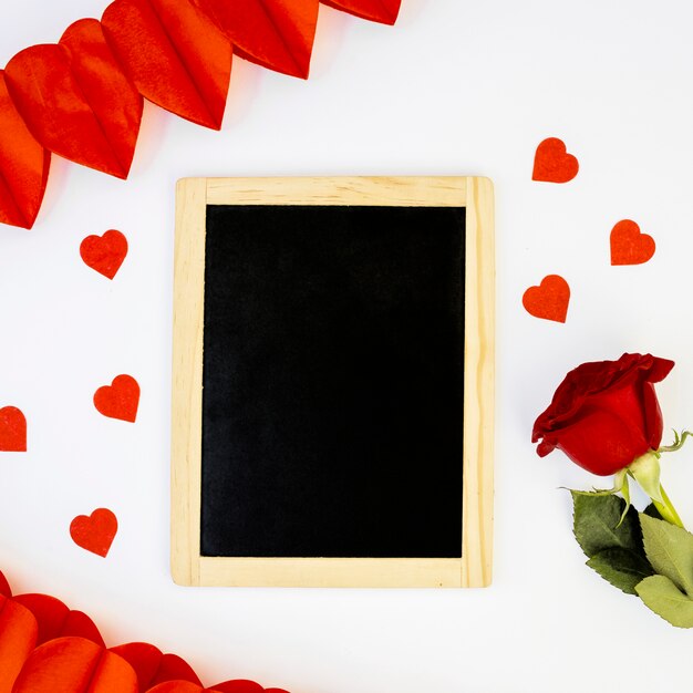 Romantic arrangement of blackboard and rose