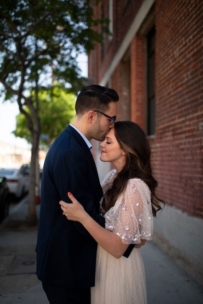 Free photo romantic couple in the city embraced after engagement