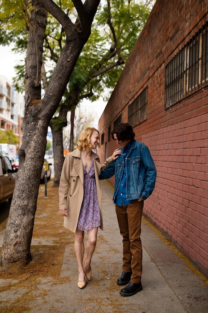 Romantic couple in the city with engagement ring after proposal