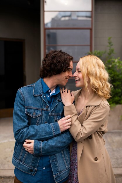 Romantic couple in the city with engagement ring after proposal