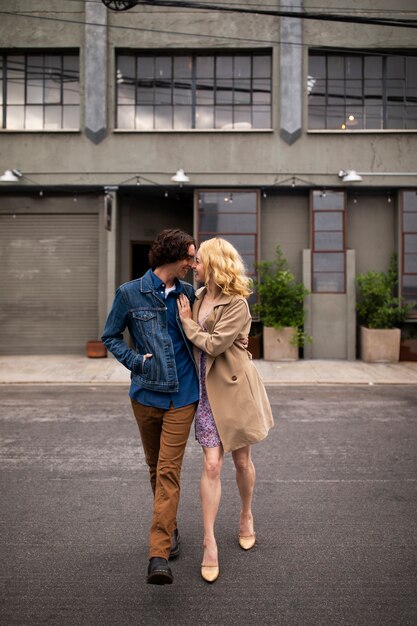 Romantic couple in the city with engagement ring after proposal