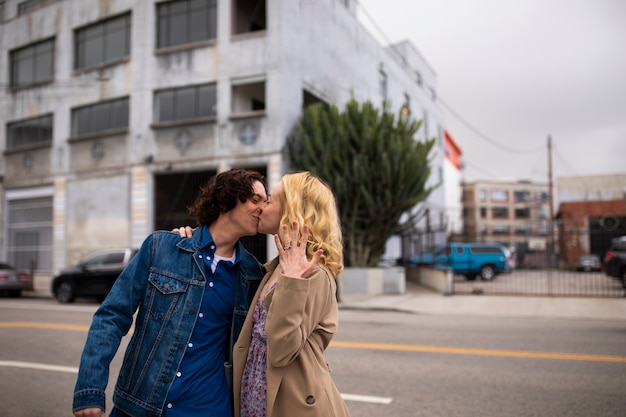 Free photo romantic couple in the city with engagement ring after proposal