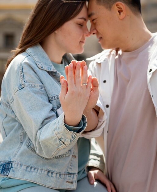 Romantic couple holding hands close up