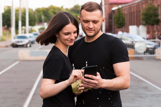 Romantic couple looking at phone