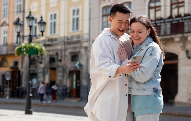 Romantic couple looking at phone