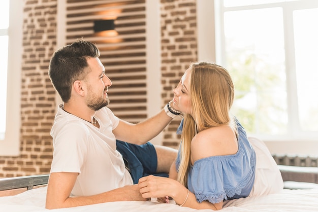 Romantic couple lying on bed