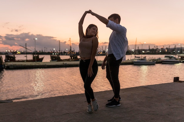 Romantic couple out at sunset in harbor