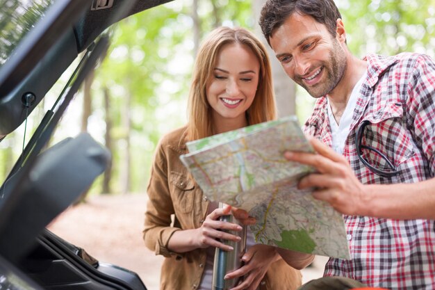 Romantic couple planning go hiking in the forest