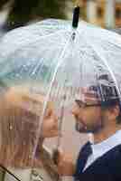 Free photo romantic couple under the umbrella