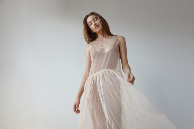 Romantic delicate woman in transparent ballerina's dres