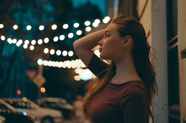 Romantic female portrait with city lights