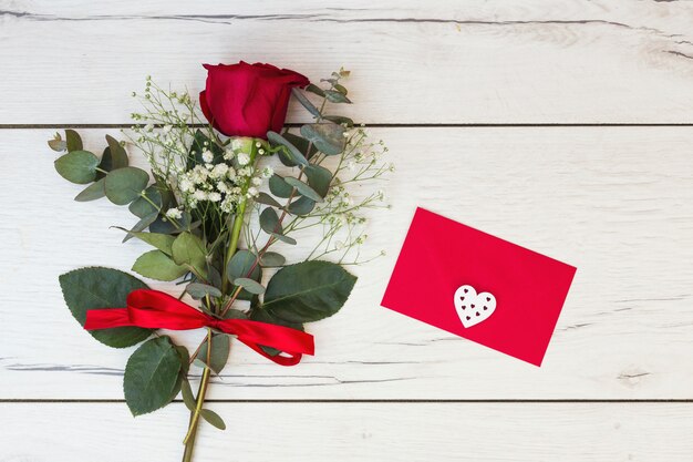 Romantic greeting card with red rose