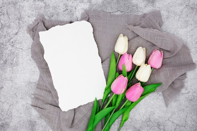 Romantic greeting with tulips on a gray marble