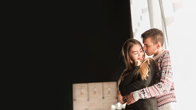 Romantic loving young couple at home