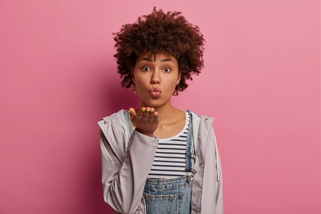 Romantic sensual Afro American woman pulls palm towards