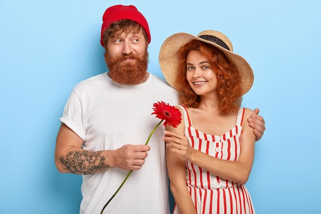 Free photo romantic stylish ginger couple posing together