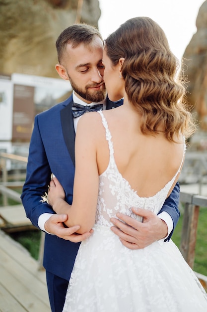 Romantic wedding couple in love walks in the mountains and forest