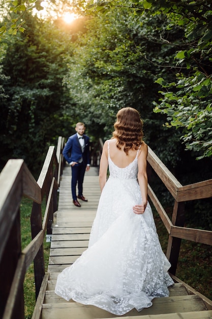 Romantic wedding couple in love walks in the mountains and forest