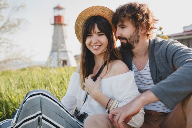 Romantic young hipster couple in countryside