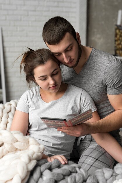 Romantic young man and woman together in bed