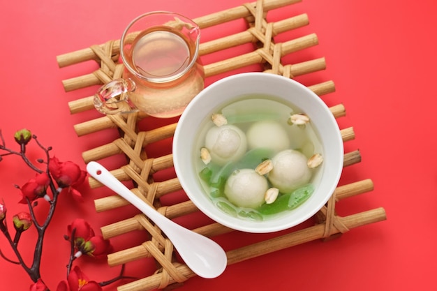 Ronde tang yuan glutinous rice dumpling balls is a traditional warm drink with ginger