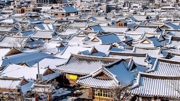 Roof of Jeonju traditional Korean village covered with snow, Jeonju Hanok village in winter, South Korea