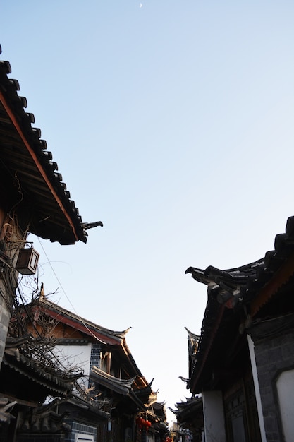 Roofs of houses with sky background