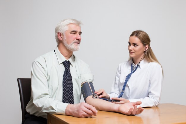 room stethoscope two sitting young measuring