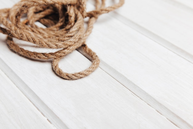 Free photo rope on wooden surface