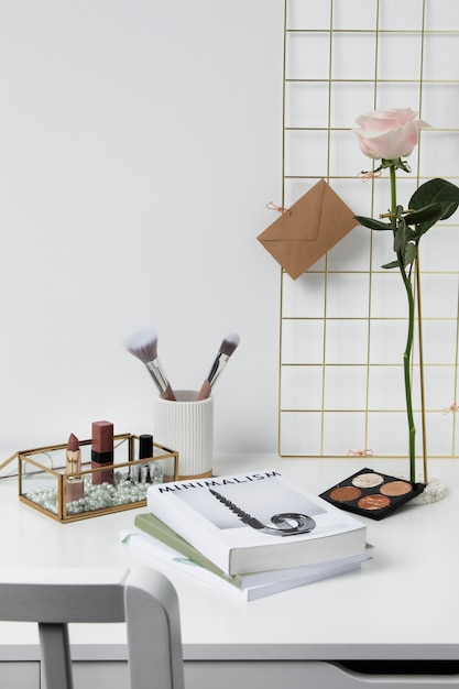 Free photo rose, book and makeup arrangement