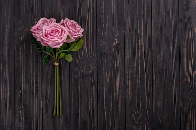 Rose bouquet on wooden tabletop