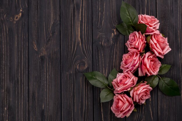 Rose composition on wooden tabletop