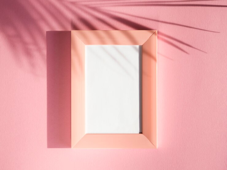 Free Photo rose portrait frames on a rose background with a palm leaf shadow