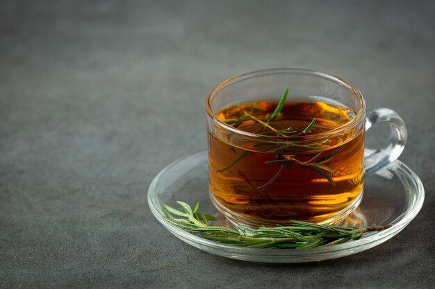 Free photo rosemary hot tea in cup ready to drink