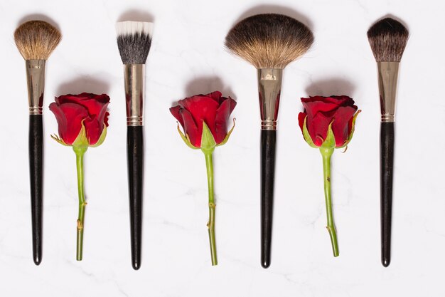 Free photo roses and makeup brushes