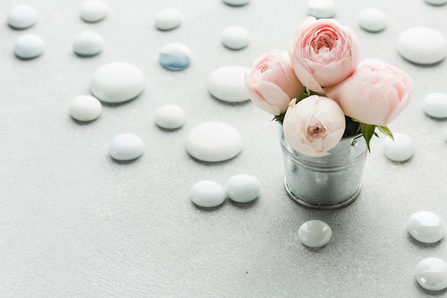 Free photo roses in a metallic bucket high view