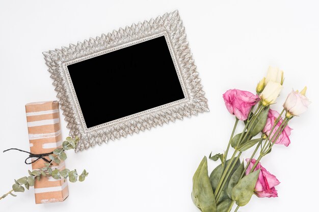 Roses with blank frame and gift box 