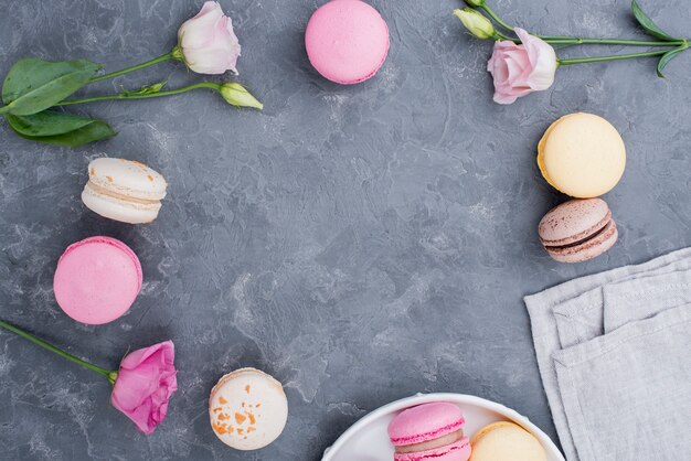 Roses with macarons on plate
