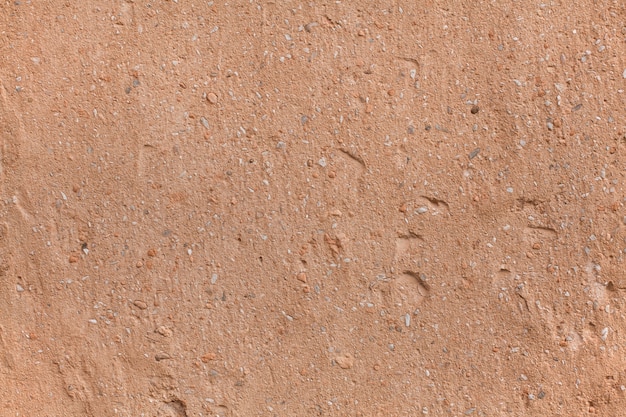 Free photo rough brown stoned surface