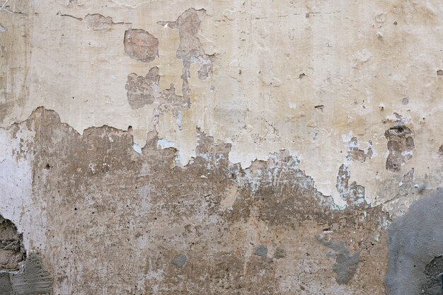 Rough concrete wall with peeling