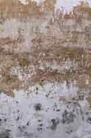 Бесплатное фото Грубая поверхность стены с грязью