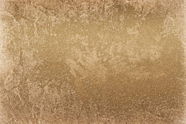 Roughly gold painted concrete wall surface background