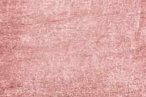 Free photo roughly pink gold painted concrete wall surface background