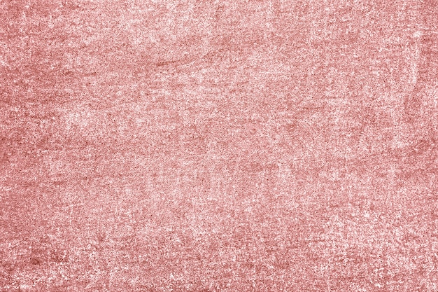 Roughly pink gold painted concrete wall surface background