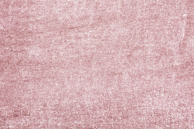 Roughly pink gold painted concrete wall surface background