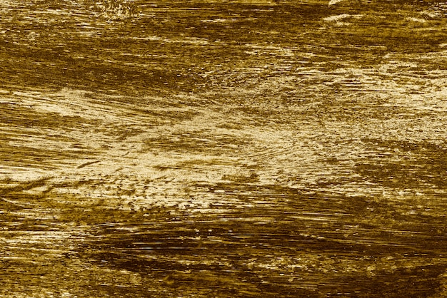 Free photo roughly shiny gold textured background