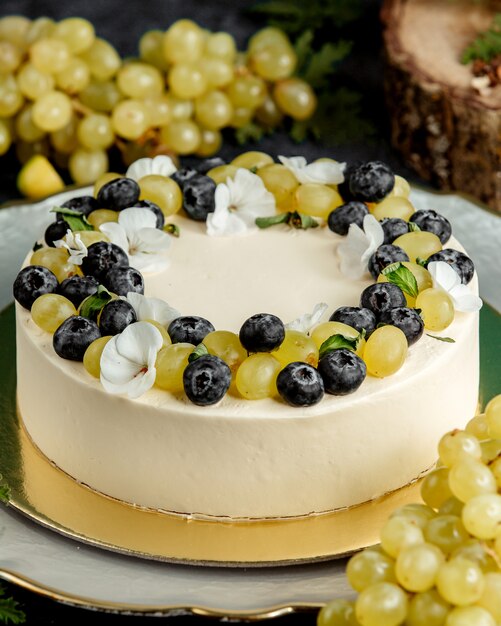 Round cake decorated with white and blueberry