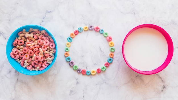 Round frame from cereals with bowls on table 