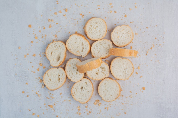 Free photo round fresh white bread on marble background.